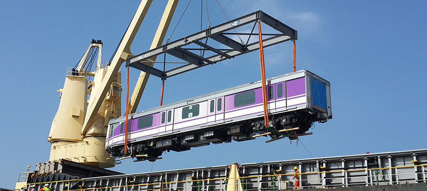 Train carriage being lifted from ship