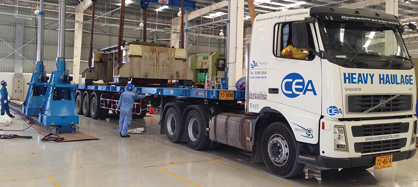 CEA Prime mover with trailer unloading metal press parts inside factory