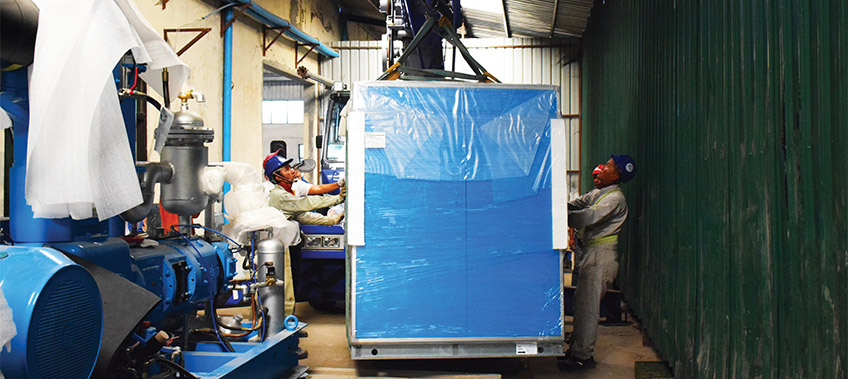 Bottle Blower being moved through the factory