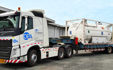 A white CEA Project Logistics Prime mover transporting industrial gas and liquids